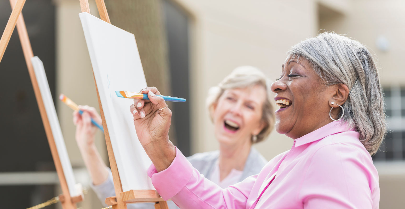 Importance of Referral Marketing. Two ladies laughing and painting together